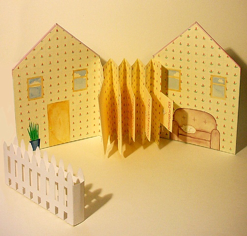 House-shaped accordian book with paper envelope flaps