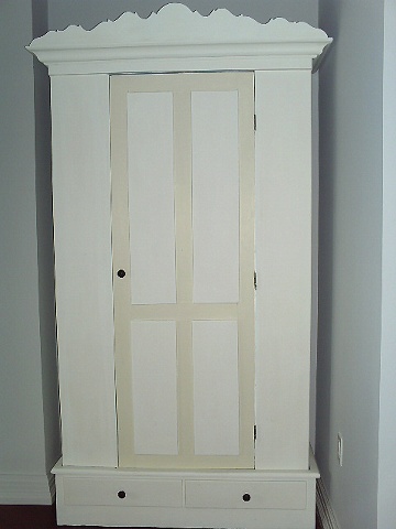 Antique Armoire is the perfect scale for a small bedroom by Jane Interiors NYC