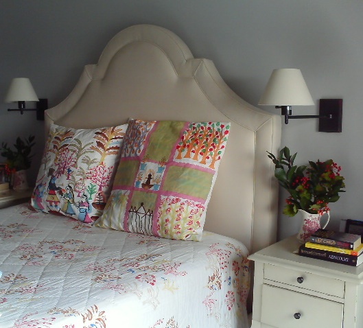 Upholstered headboard in a small bedroom by Jane Interiors NYC