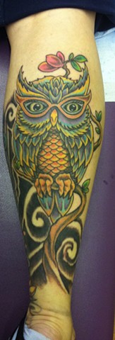 Owl on calf