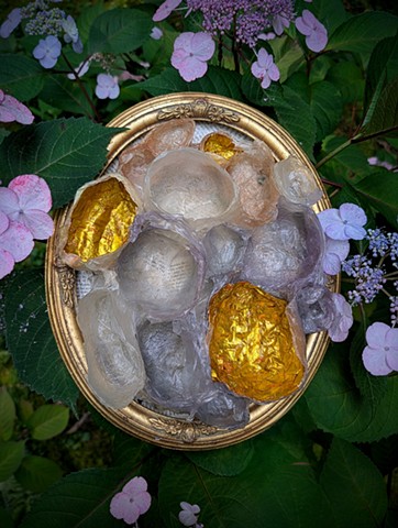 “In 2021, I was diagnosed with breast cancer and embarked on the physical trauma of treatment and the emotional journey of processing my own mortality. What accompanied me was my deep gratitude to be able to process my grief as well as my joy in life through time in nature and making art.  The materials were chosen to be able to decompose-- the plant fibers are softened, dyed and molded before they are arranged and hung-- using natural materials that can return to the earth but currently reflect celebration and transformation.  I see myself in these pieces: a body changed and scared, an experience still being processed.”-- Kris Bespalec