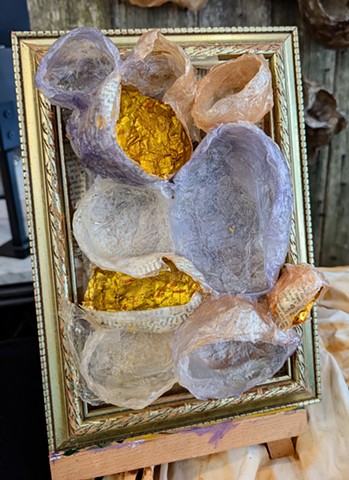 “In 2021, I was diagnosed with breast cancer and embarked on the physical trauma of treatment and the emotional journey of processing my own mortality. What accompanied me was my deep gratitude to be able to process my grief as well as my joy in life through time in nature and making art.  The materials were chosen to be able to decompose-- the plant fibers are softened, dyed and molded before they are arranged and hung-- using natural materials that can return to the earth but currently reflect celebration and transformation.  I see myself in these pieces: a body changed and scared, an experience still being processed.”-- Kris Bespalec