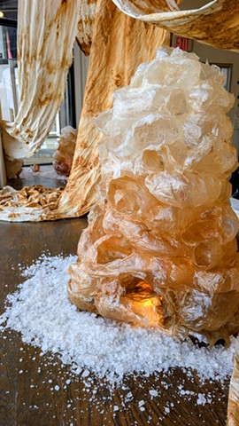 Sacred Bodies is an evolving sculptural body of work that explores the role of bearing witness-- to see and be seen-- and to the act of being present through ritual gestures and sacred place making. Referencing the ancient art of stacking stones, emerging from the egg, building towards the sky and leaving a bit of ourselves behind or taking a small piece with us, we are all participants in our sacred and profane world.    Sanctuary invites the viewer to enter, breathe, and soften within the stillness and glow of the Sacred Bodies. Guests are invited to move quietly throughout the installation, finding spaces for rest and reflection.