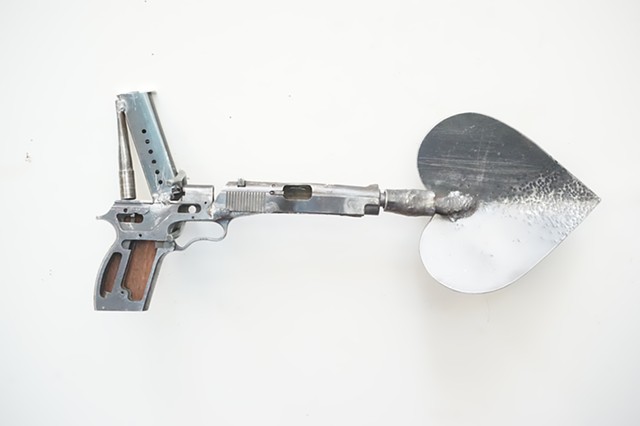 Hand Gun Spade, Guns to Plowshares