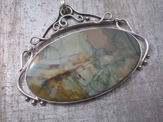 A large jasper in a hinged sterling setting...