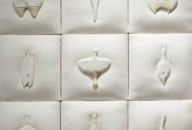 detail of wall installation comprised of painted ceramic on linen with stitching by Mary Meyer