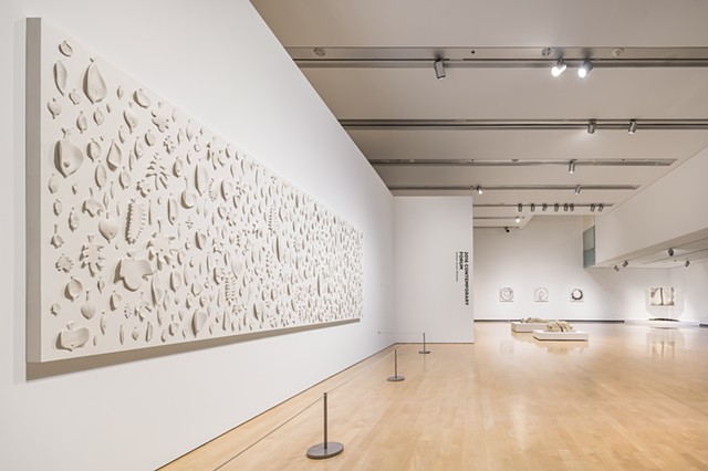 wall panel comprised of porcelain and sewing needles by Mary Meyer