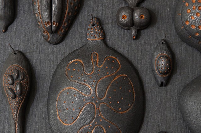 Biophilia (seeds) detail | black clay, graphite, pigment, sewing needles | dimensions vary