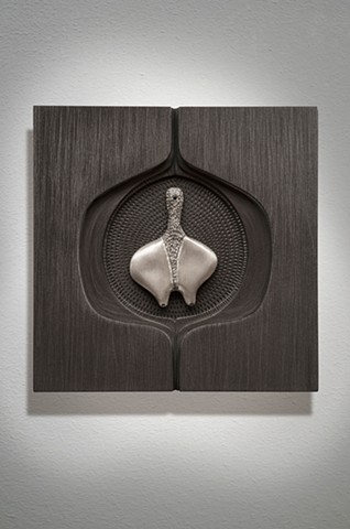 wall sculpture comprised of cast aluminum, wood, graphite, and sewing needle by Mary Meyer
