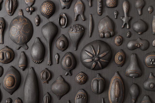 Biophilia (seeds) detail | black clay, graphite, pigment, sewing needles | dimensions vary