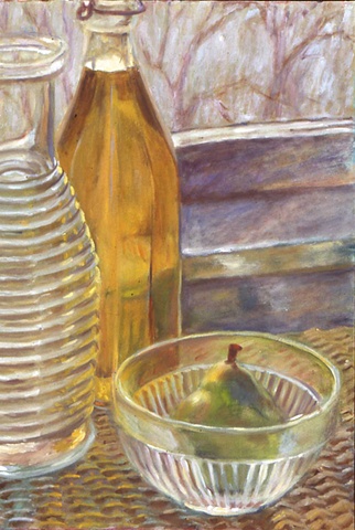 glass carafe and bowl with light on pear
