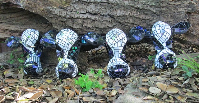 4 Calves. Mosaic on cement. Approx 8" to 10" wide.
