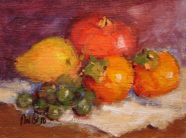 Two persimmons, pom and grapes