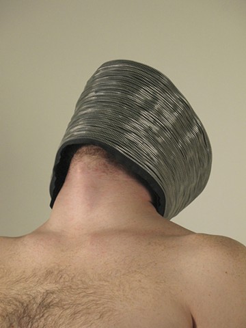 Blind, 2008. Machine-sewn zippers modeled by Joseph Belknap, 10” x 14” x 14”.