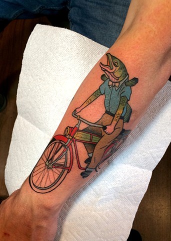 fish riding bike tattoo by dave wah at stay humble tattoo company in baltimore maryland the best tattoo shop in baltimore maryland
