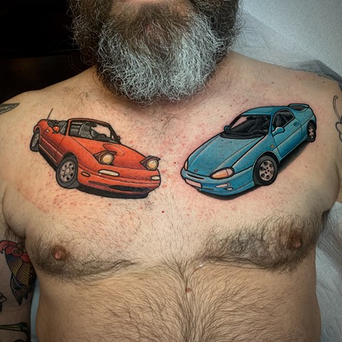mazda car chest piece tattoo by tattoo artist dave wah at stay humble tattoo company in baltimore maryland the best tattoo shop in baltimore maryland