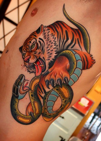 tiger and snake battle royale tattoo by dave wah at stay humble tattoo company in baltimore maryland