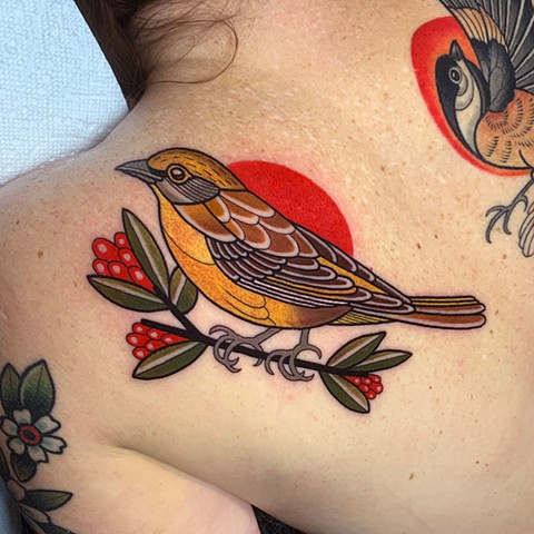 female scarlet tanager bird tattoo by tattoo artist dave wah at stay humble tattoo company in baltimore maryland the best tattoo shop in baltimore maryland