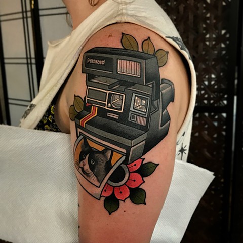 polaroid camera tattoo by dave wah at stay humble tattoo company in baltimore maryland the best tattoo shop and artist in baltimore maryland
