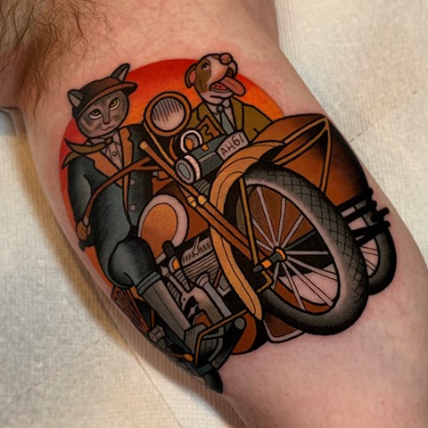 cat and dog and motorcycle tattoo by dave wah at stay humble tattoo company in baltimore maryland the best tattoo shop and artist in baltimore maryland