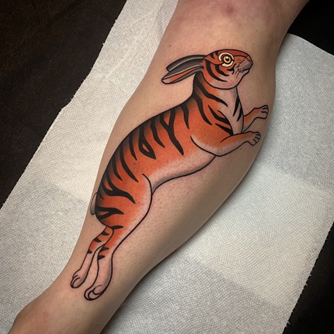 tiger rabbit tattoo by tattoo artist dave wah at stay humble tattoo company in baltimore maryland the best tattoo shop in baltimore maryland