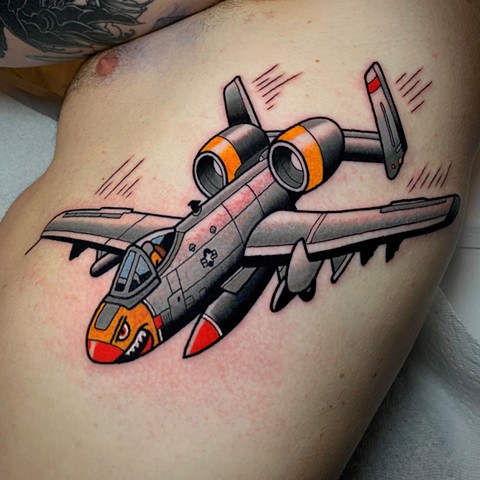 airplane jet A-10 thunderbolt 2 tattoo by tattoo artist dave wah at stay humble tattoo company in baltimore maryland the best tattoo shop in baltimore maryland
