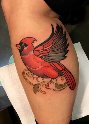 cardinal bird tattoo by tattoo artist dave wah at stay humble tattoo company in baltimore maryland the best tattoo shop in baltimore maryland