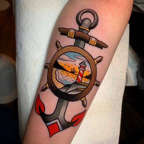 anchor and lighthouse tattoo by tattoo artist dave wah at stay humble tattoo company in baltimore maryland the best tattoo shop in baltimore maryland