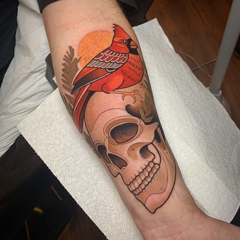 cardinal and skull tattoo by tattoo artist dave wah at stay humble tattoo company in baltimore maryland the best tattoo shop in baltimore maryland
