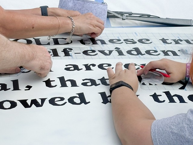 Teens working on car during summer 2024 Art & Civics Camp