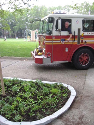 diverting traffic for local tomato growing firefighters