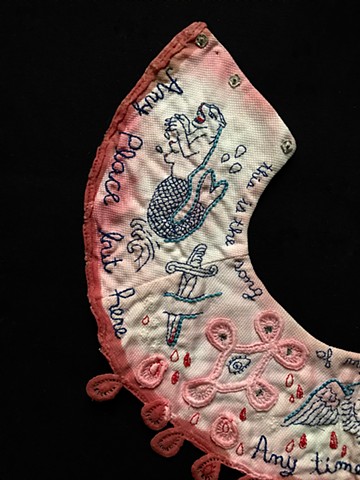 vintage collar with embroidered tattoo imagery