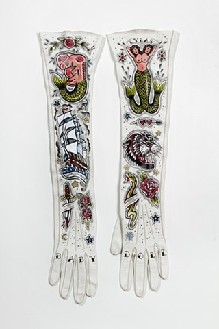 traditional tattoo designs of mermaids on vintage gloves