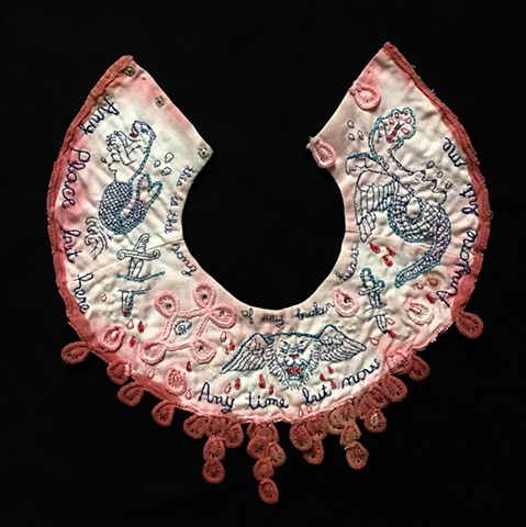 embroidered tattoo imagery on vintage collar