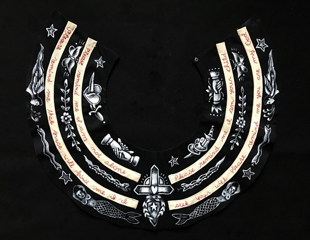 Tattoo motifs embroidered on vintage collars dealing with spirituality and faith