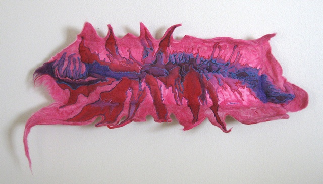 "Metamorphosis of the Pink Thing" is a felted mixed media piece of contemporary fiber art by Linda Thiemann. 