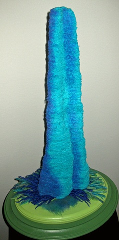 "Texas Twilight Hoodoo" is a felted, stacked fabric mixed media piece of contemporary fiber art by Linda Thiemann.