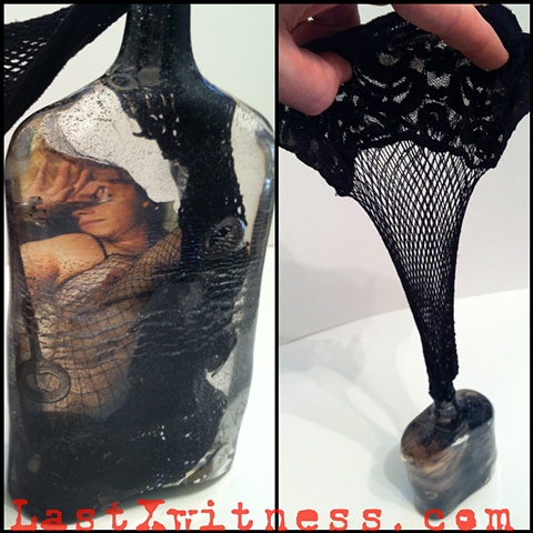 (1 of 3) Resin cast from antique bottle with photo emulsion, fishnest stocking, old keys, and razor blades
