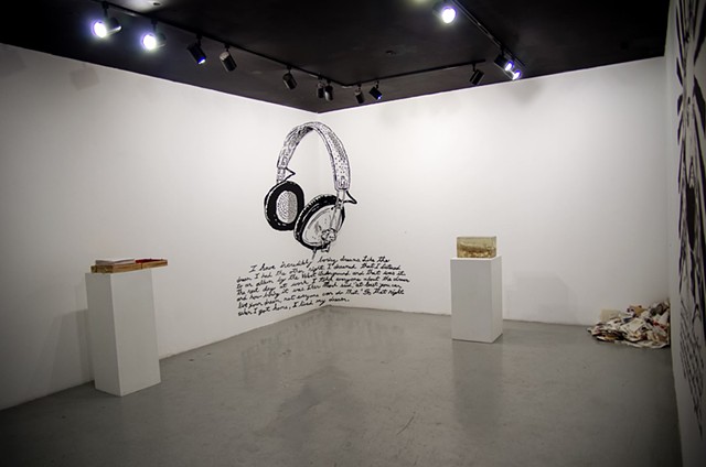 installation view of monologue show with wall drawing and sculptures
