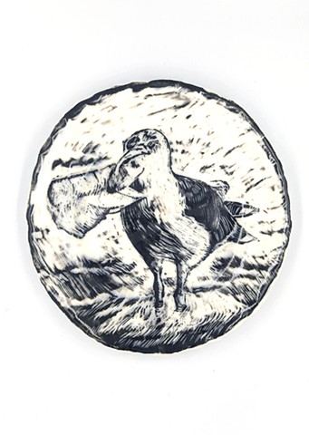 Hand built porcelain plate with black slip and sgraffito