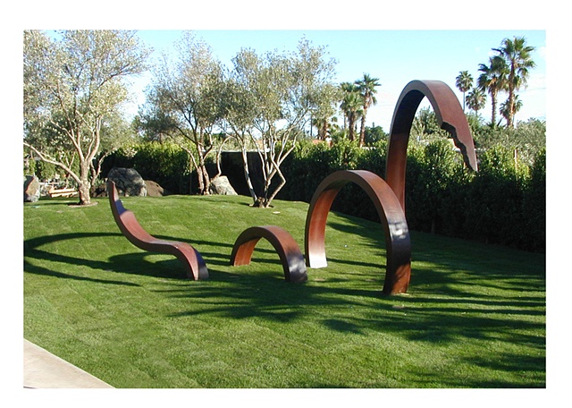 Large outdoor patinated steel sculpture that moved in and out of the ground in ever-increasing rings.