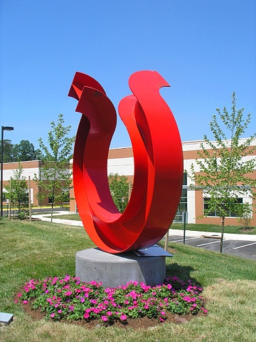 Large, red, painted steel corporate commission