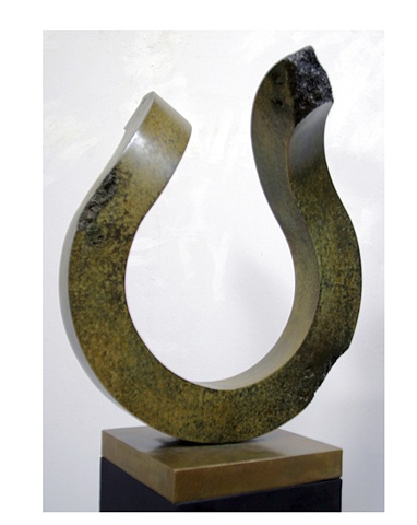 Pedestal bronze sculpture with green and gold patina on gold bronze base.