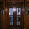 Custom wood cabinetry- both sides of French doors