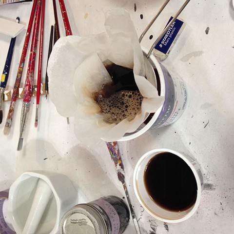 After the acorn caps are strained out, the warm ink is filtered through a coffee filter to catch any small debris.