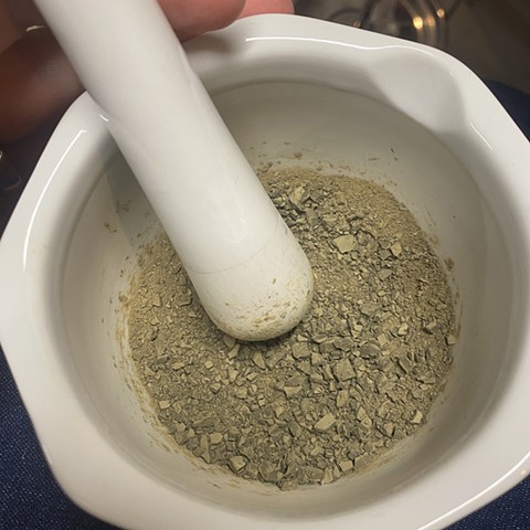 Grinding Hakone grass lake pigment into a smooth powder