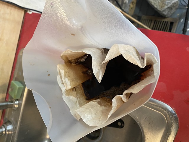 The ink is strained through a coffee filter to remove smaller organic matter.