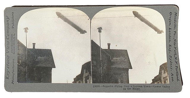394--(18000) Zeppelin Flying Over A German Town (recto)
