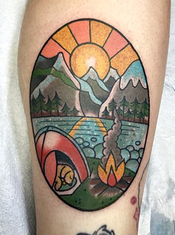 Bold traditional tattoo of Lake Louise Alberta with a camping scene and mountains in bright colours made in Toronto Ontario Canada