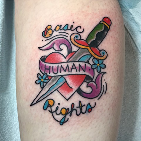 Traditional heart tattoo with bright colours in a bold style for human rights made in Toronto Ontario Canada